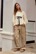 Load image into Gallery viewer, LovLov Solid Color Top with Contrasting Bow and Lace Details in Ivory/Black ON ORDER