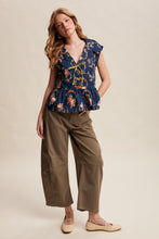 Load image into Gallery viewer, Listicle Floral Peplum Tie-Front Top in Navy