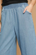 Load image into Gallery viewer, Umgee Fringe Hem Denim Pants in Light Denim