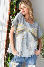 Load image into Gallery viewer, Oli & Hali Paint Splatter Top with Large Ribbon Bow Patch on Front in Blue