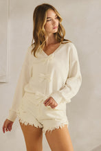 Load image into Gallery viewer, LovLov Solid Color Knit Cardigan with Bow Front Details in Ivory