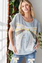 Load image into Gallery viewer, Oli & Hali Paint Splatter Top with Large Ribbon Bow Patch on Front in Blue