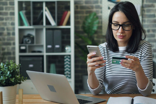 Woman using a credit card to shop online