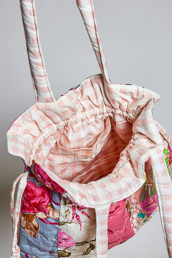 POL Floral Quilted Drawstring Shoulder Bag in Pink Multi