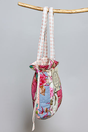 POL Floral Quilted Drawstring Shoulder Bag in Pink Multi