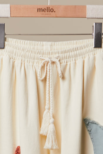 mello. Sun and Moon Patched Wide Leg Pants in Ivory