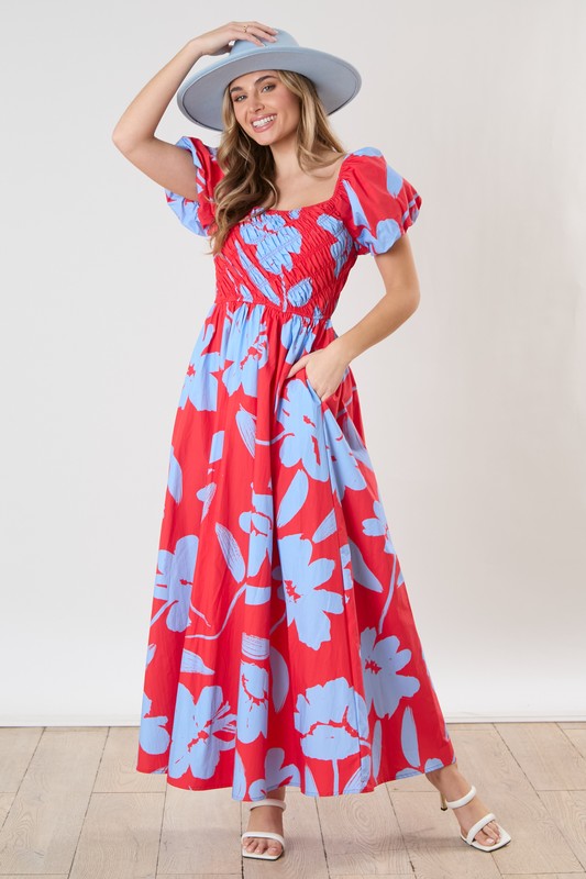 red maxi dress with flowers Amy Floral in 100% Polyester Hand Wash Cold Manufactured in China Designed in The USA Model is 58 is Wearing a Size Small Aylin Red Floral Ruched Halter