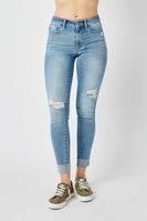 Judy Mid Rise Destroyed and Cuffed Skinny Denim Jeans in Medium Wash