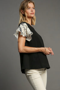 Umgee Solid Color Knit Top with Contrasting Print Sleeves in Black