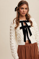 Listicle Open Front Cable Knit Cardigan with Contrasting Color Bow Tie Front in Cream