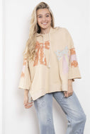 BlueVelvet Terry Knit Pullover Top with Contrasting Print Bow Patches and Stripes in Natural