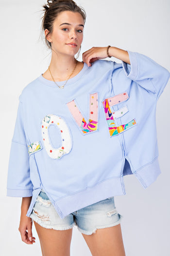 Easel OVERSIZED Top with Mixed Print LOVE Letter Patch Front in Peri Blue