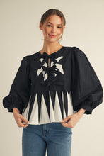 Load image into Gallery viewer, Jodifl Contrasting Bow Detail Peplum Top in Black/White
