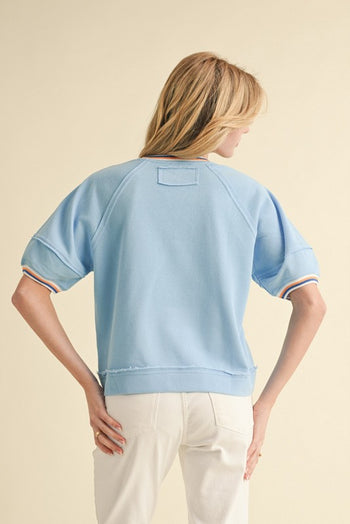 Jodifl Solid Color Knit Top with Contrasting Colored Stripes Details in Blue