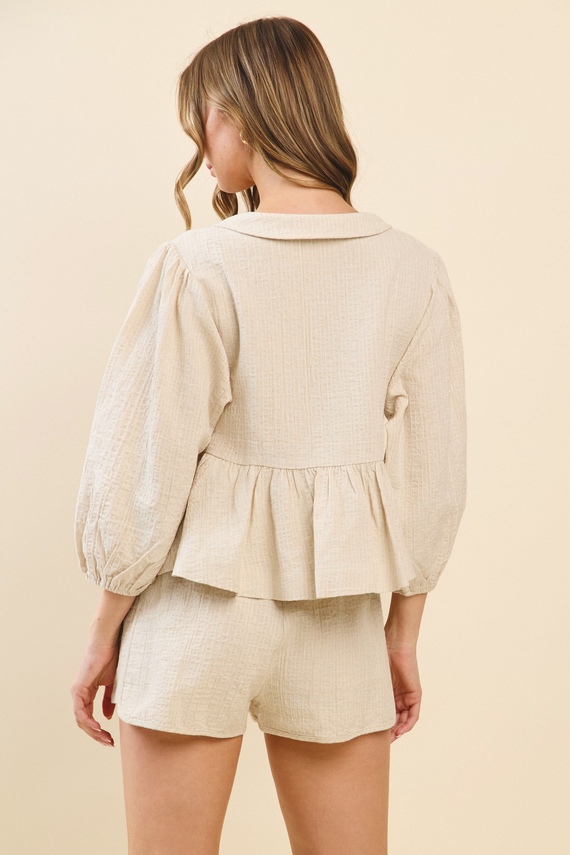 TCEC Solid Color Textured Peplum Top in Natural – June Adel