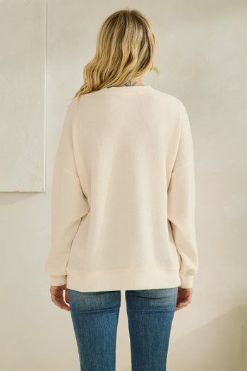 Tres Bien Solid Color Cloudy Knit Top with HOLLY JOLLY Graphic Print Front in Cream