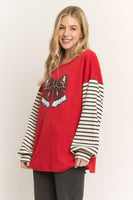 HEIMISH Textured Knit Top with Sequin Santa Bow and Contrasting Striped Sleeves in Red