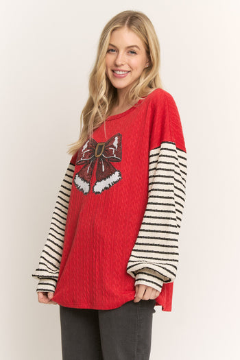 HEIMISH Textured Knit Top with Sequin Santa Bow and Contrasting Striped Sleeves in Red