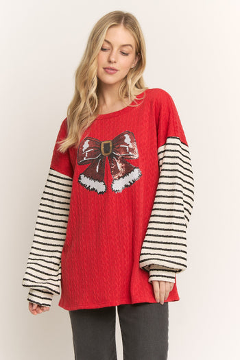 HEIMISH Textured Knit Top with Sequin Santa Bow and Contrasting Striped Sleeves in Red