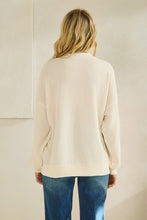 Load image into Gallery viewer, Tres Bien Solid Color Cloudy Knit Top with NAUGHTY Graphic Print Front in Cream
