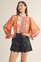 Jodifl Eyelet Ruffled Neckline Baroque Floral Top in Red/Neon Pink