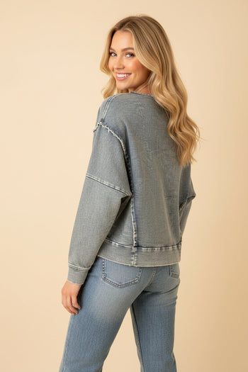 Heimish Eyelet Bow Applique Raw Edge Sweatshirt in Light Denim