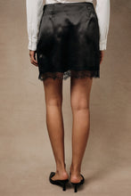 Load image into Gallery viewer, Sunday Edition High Waisted Satin Surplice Lace Trim Mini Skirt in Black
