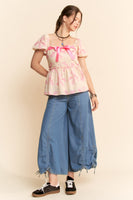 Davi & Dani Bow Print Peplum Top in Pink