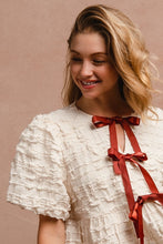 Load image into Gallery viewer, BiBi Textured Woven Peplum Bow Tie Top in Cream
