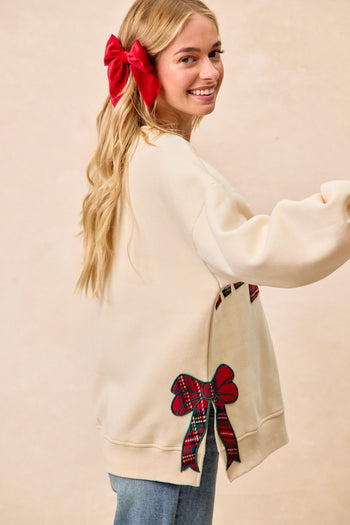 BiBi Fleece Sweatshirt with Plaid MERRY Front Patch and Side Bow Patches in Cream/Red Plaid