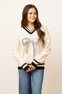 Emma+Grace Varsity Sweater with Sequin Bow on Front in Cream