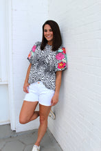 Load image into Gallery viewer, VOY Abstract Print Top with Floral Embroidery on Sleeves in Black
