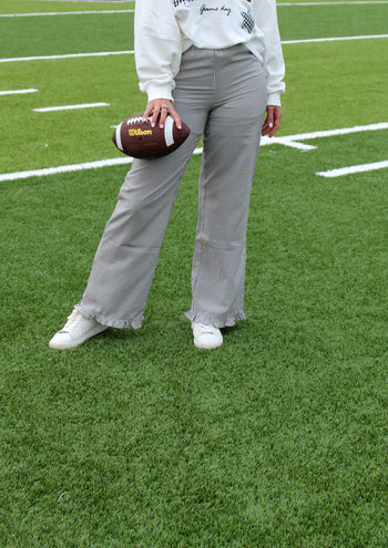 Things Between Striped Ruffle Hem Pants in Black