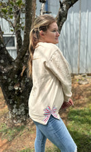 Embroidered Side Hem Red and Green Christmas Bow Sweatshirt in Sand