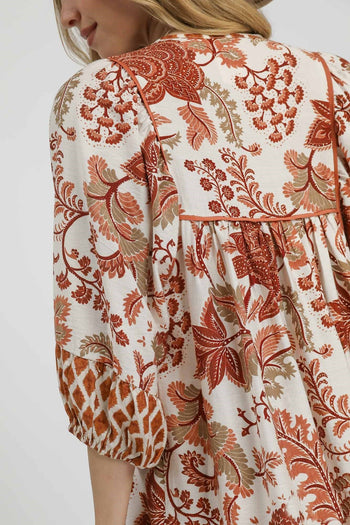 Umgee Contrasting Mixed Print Mini Dress in Rust Mix