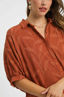 Umgee Solid Color Jacquard Textured Leaf Pattern Top in Rust