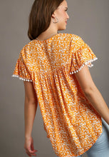 Load image into Gallery viewer, Umgee Animal Print Top with Flower Embroidery and Pom Pom Fringe Detail in Tangerine Top Umgee   
