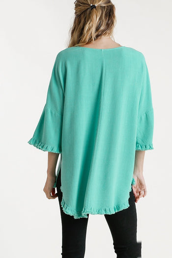 Umgee Linen Blend Long Bell Sleeve Round Neck Top with Chest Pocket and Frayed High Low Scoop Hem in Emerald