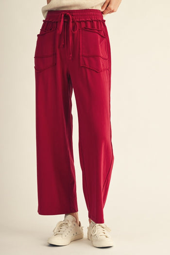 Jodifl Drawstring Waist Raw Cut Detail Sweatpants in Burgundy