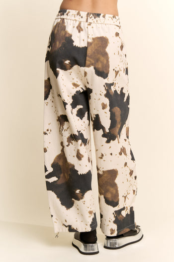 Davi & Dani Wide Leg Drawstring Hem Pants in Cow Print
