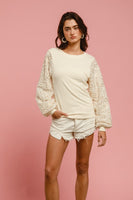 BiBi Solid Color Ribbed Top with Chenille and Sequin Floral Sleeves in Cream