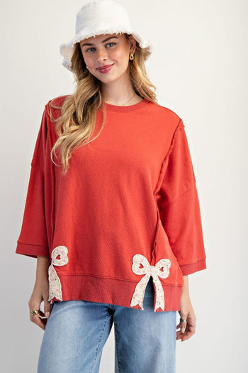 Easel Solid Color Terry Knit Top with Applique Bows on Hem in Boho Red