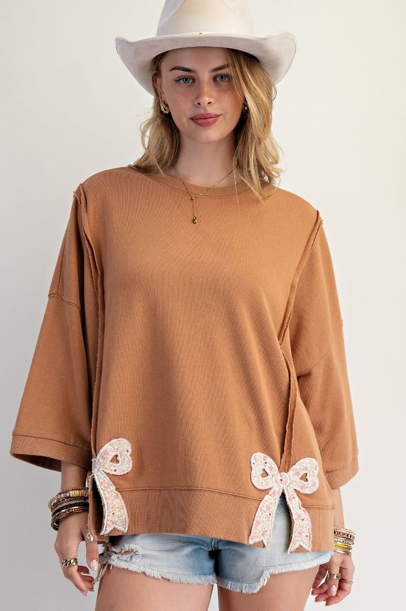 Easel Solid Color Terry Knit Top with Applique Bows on Hem in Camel