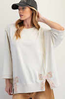 Easel Solid Color Terry Knit Top with Applique Bows on Hem in Ivory