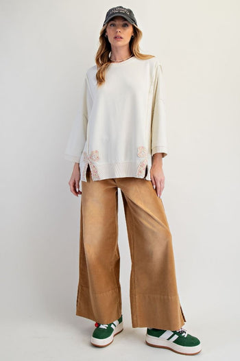 Easel Solid Color Terry Knit Top with Applique Bows on Hem in Ivory