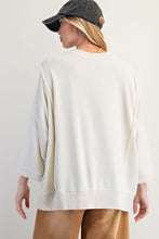 Load image into Gallery viewer, Easel Solid Color Terry Knit Top with Applique Bows on Hem in Ivory
