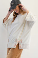 Easel Solid Color Terry Knit Top with Applique Bows on Hem in Ivory