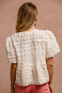 BiBi Textured Woven Peplum Bow Tie Top in Cream